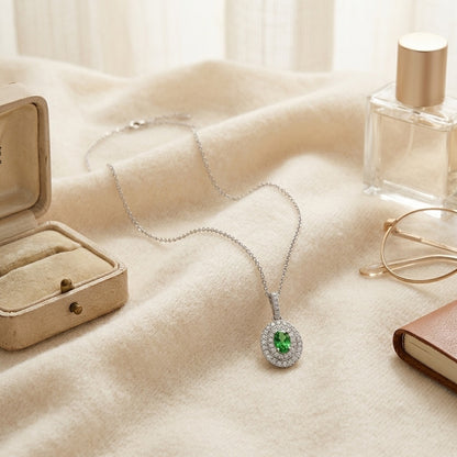 Tsavorite and Diamond Double Oval Halo Pendant in 14k White Gold 17 in Curb Chain — textile flat lay