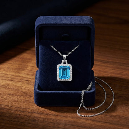 Swiss Blue Topaz And Diamond Halo Pendant With Trapezoid Bail In 14k White Gold — gift presentation