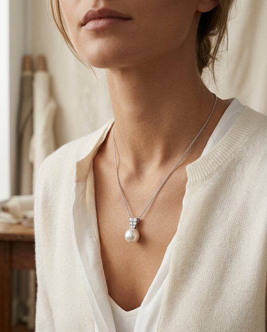White Cultured Akoya Pearl Pendant With Diamond Prong-set Tapered Bail In 14k White Gold — editorial close-up
