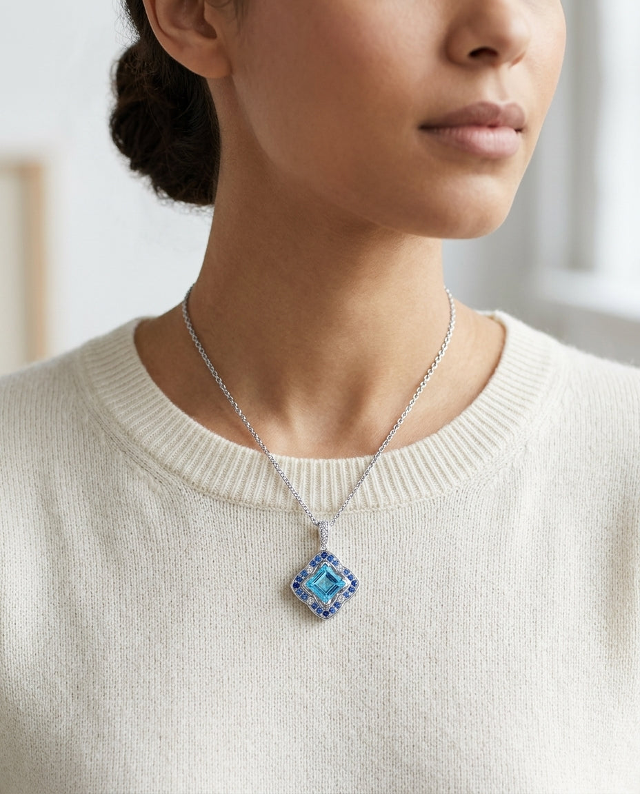 Swiss Blue Topaz, Sapphire And Diamond Pendant In 14k White Gold — editorial close-up