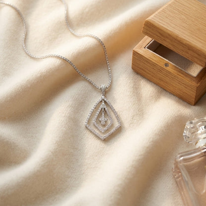 Pave Diamond Pendant in 14k White Gold (5/8 Ct. Tw.) — textile flat lay