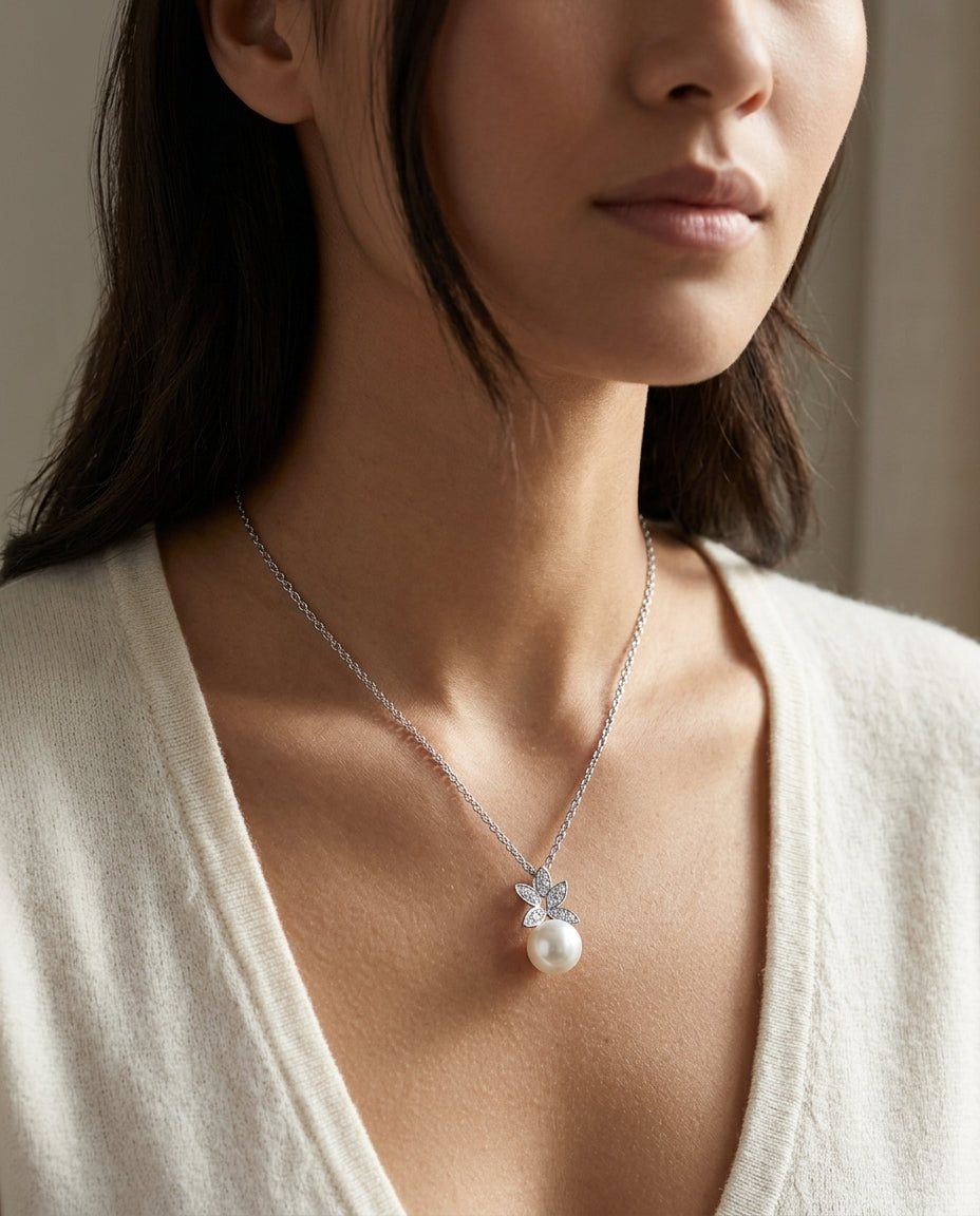 Fresh Water Pearl And Diamond Butterfly Pendant In 14k White Gold — editorial close-up