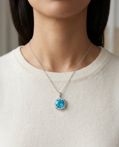 Blue Topaz And Diamond Round Halo Pinched Corner Pendant In 14k White Gold ( Hi / Si ) — editorial close-up