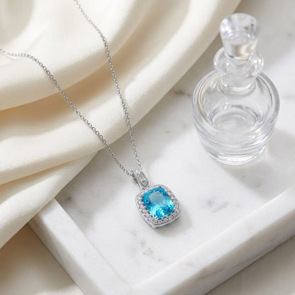 Blue Topaz And Diamond Elongated Cushion Halo Pendant In 14k White Gold — atelier still life