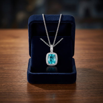 Blue Topaz And Diamond Elongated Cushion Halo Pendant In 14k White Gold — gift presentation