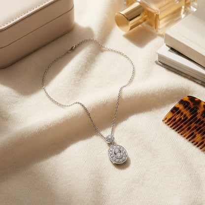 Diamond Oval Halo Dangle Pendant in 14k White Gold, 17 Inch Chain (1/3ctw) — textile flat lay