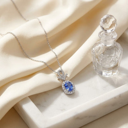 Sapphire Oval and Pave Diamond Halo Pendant in 14k White Gold — marble silk