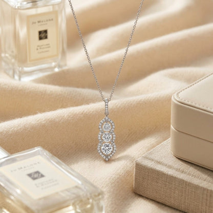 3 Stone Vertical Pendant with Minaret Tips in 14k White Gold — textile flat lay