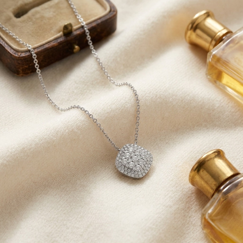 Diamond Micro-Prong Set Cushion Shape Pendant with Double Border in 14k White Gold — textile flat lay