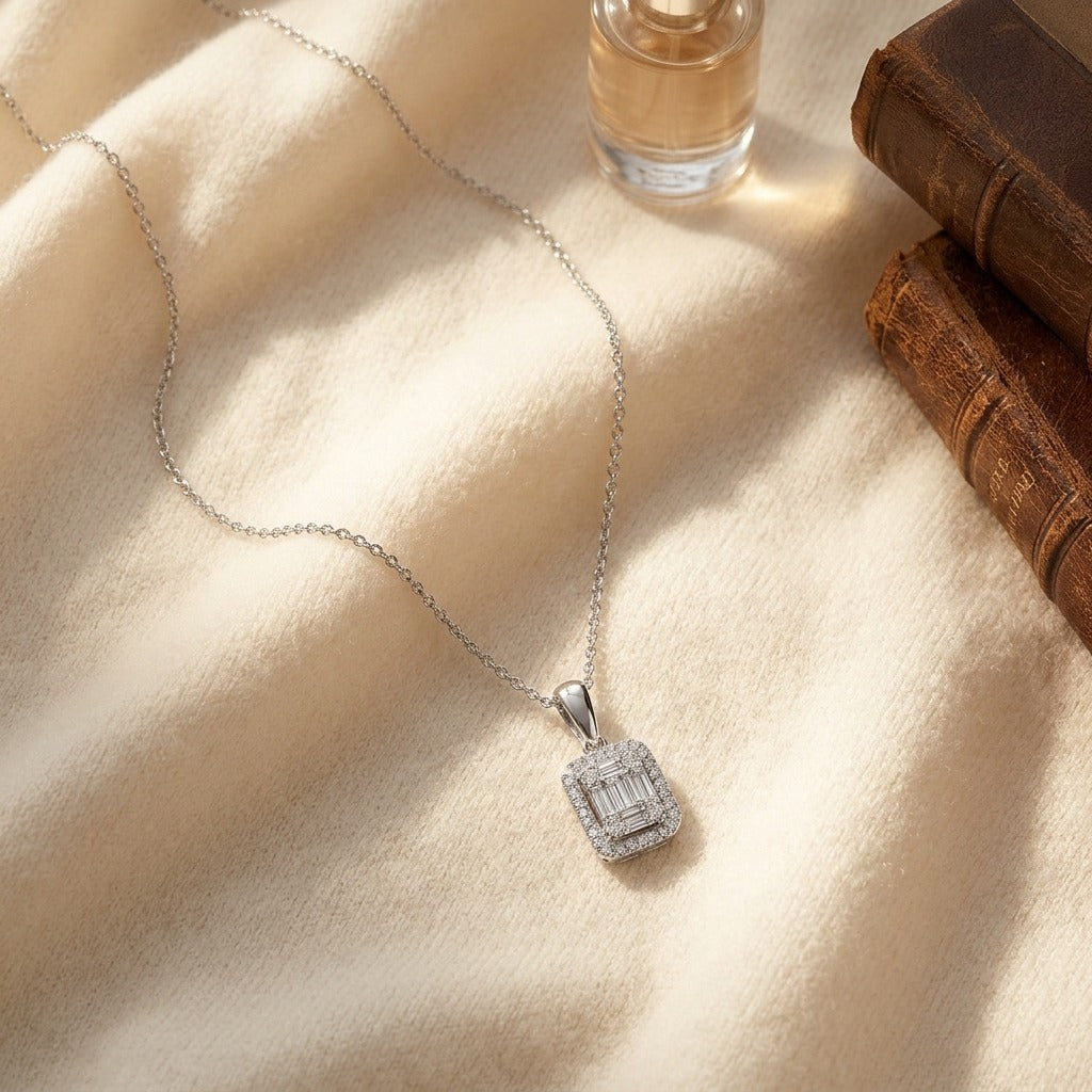 Diamond Baguette and Round Illusion Emerald-Cut Halo Pendant with Solid Bail in 14k White Gold — textile flat lay