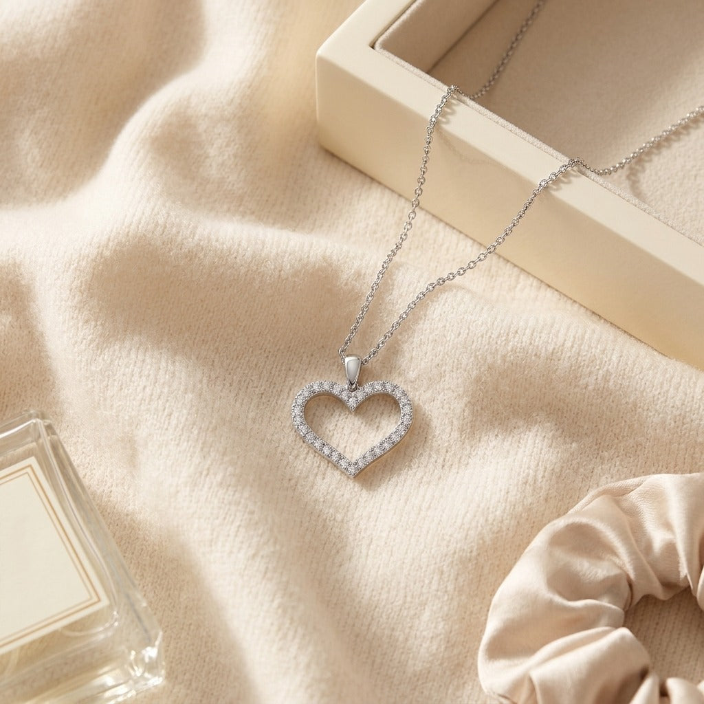 Diamond Heart Pendant with Textured Borders in 14k White Gold — textile flat lay