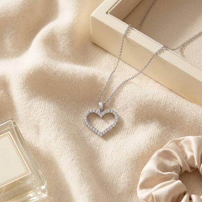 Diamond Heart Pendant with Textured Borders in 14k White Gold — textile flat lay