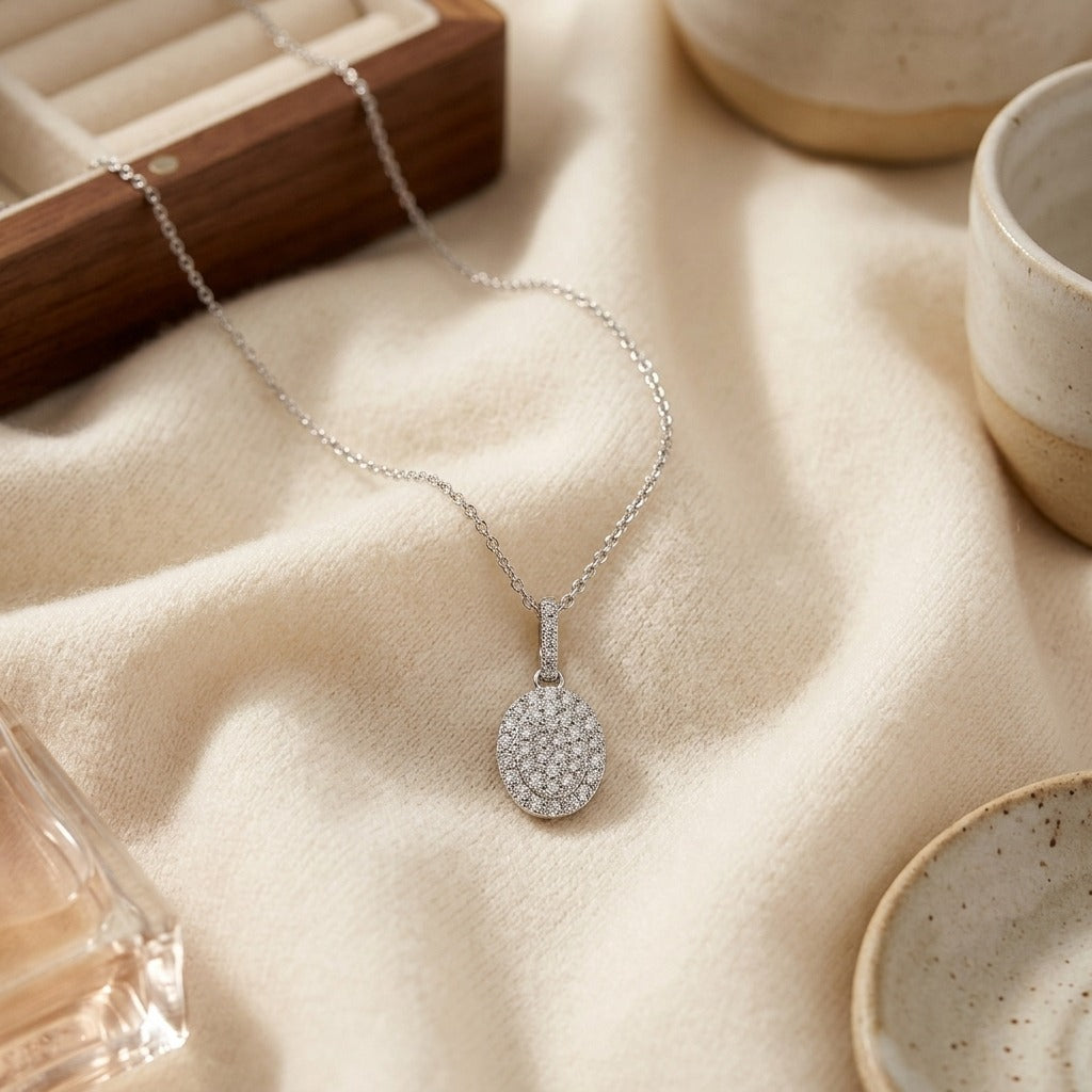 Diamond Pave Disk Pendant with Bail in 14k White Gold — textile flat lay