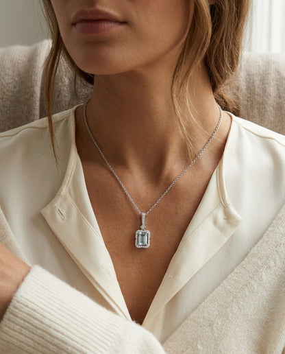 Aquamarine Emerald Cut Halo Pendant in 14k White Gold 1/6ctw — editorial close-up
