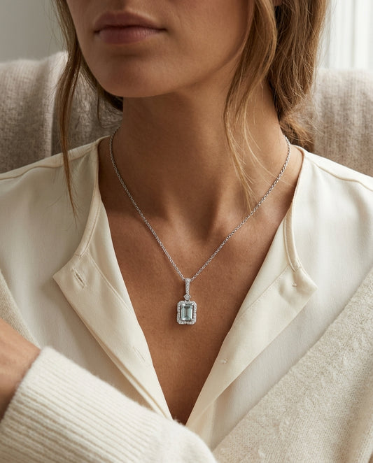 Aquamarine Emerald Cut Halo Pendant in 14k White Gold 1/6ctw — editorial close-up
