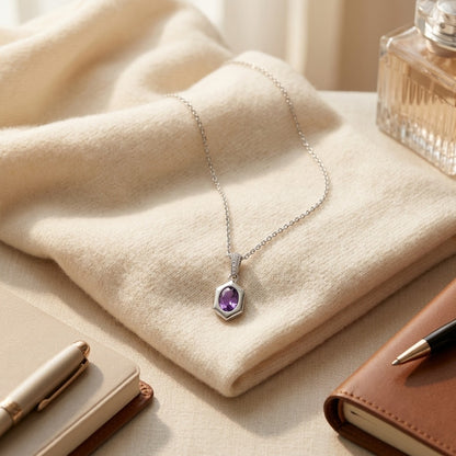 Oval Amethyst Pendant 0.70ct and 0.028ctw Diamond Set in 14k White Gold 16-18 Adj Chain — textile flat lay