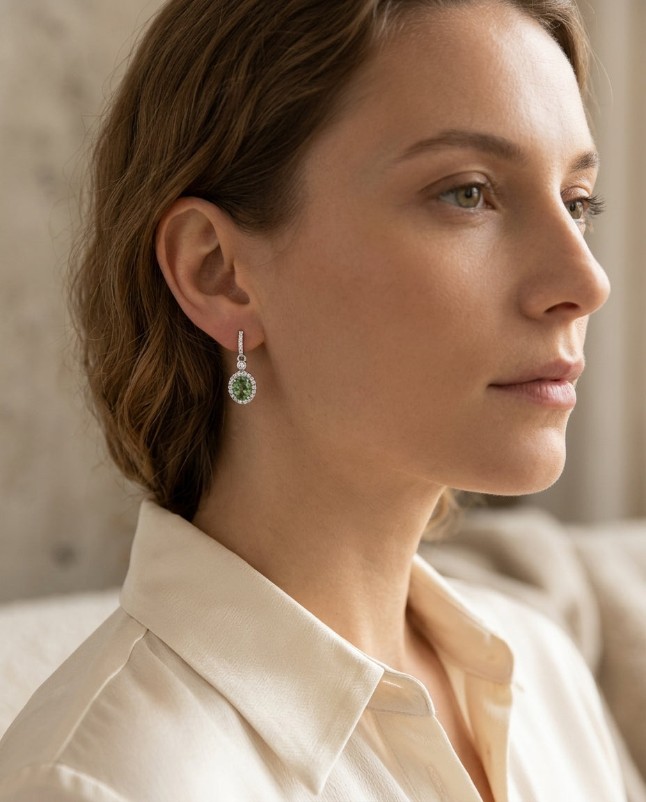 Created Emerald And Diamond Oval Halo Dangle Earrings In 14k White Gold — editorial close-up