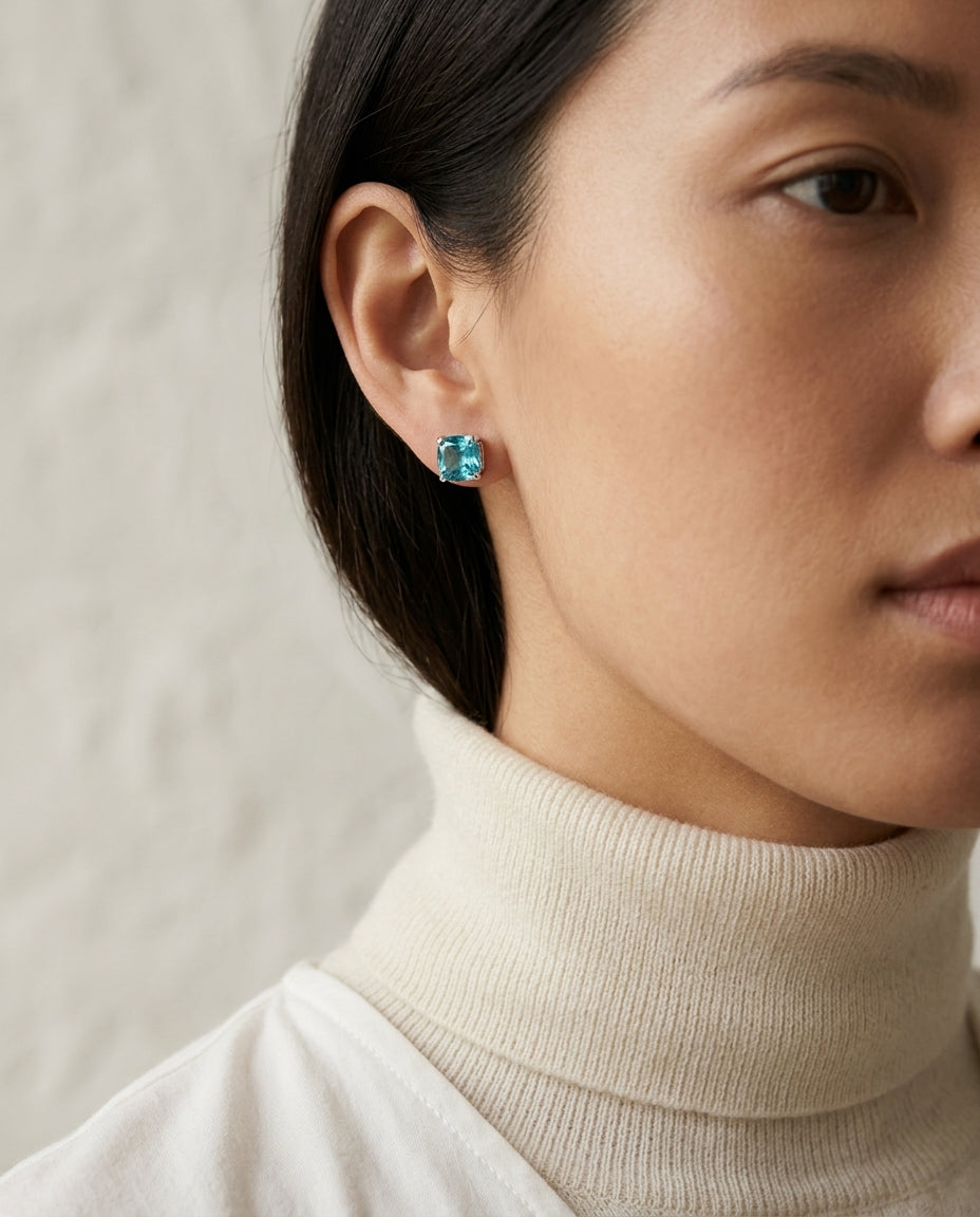 Blue Topaz Cushion Stud Earrings In 14k White Gold (8mm) — editorial close-up