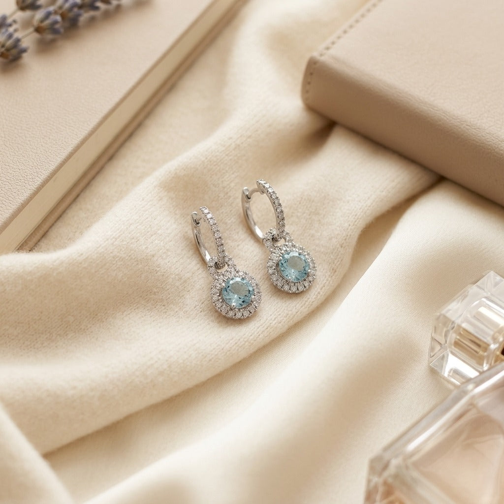 Aquamarine And Diamond Door Knocker Dangle Earrings in 14k White Gold — textile flat lay