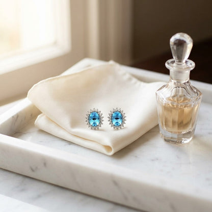 Blue Topaz And Diamond Prong Oval Halo Stud Earrings in 14k White Gold — marble silk