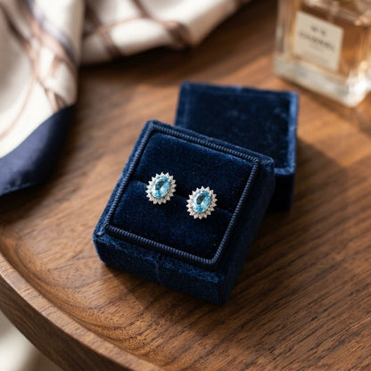 Blue Topaz And Diamond Prong Oval Halo Stud Earrings in 14k White Gold — velvet box