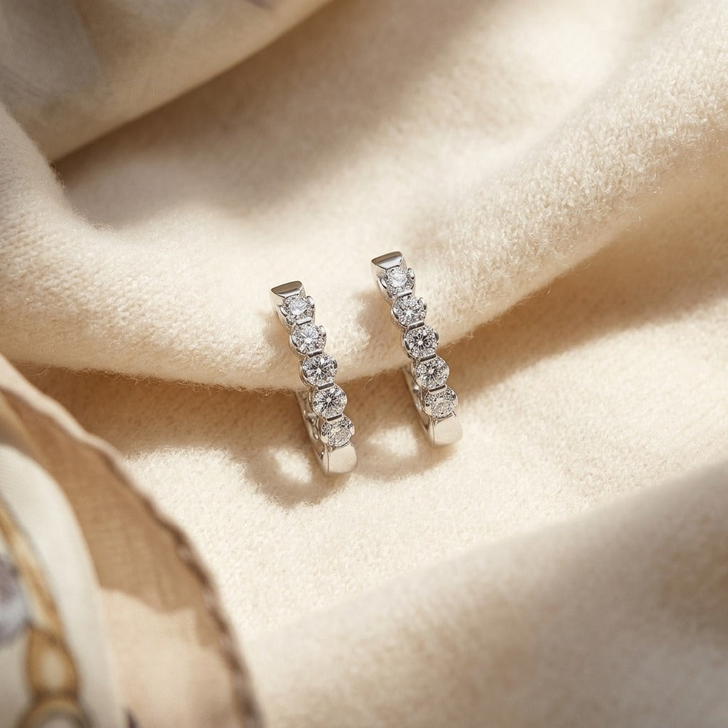 Diamond Hinged Oval Hoop Earrings in 14k White Gold 3/4ctw — textile flat lay