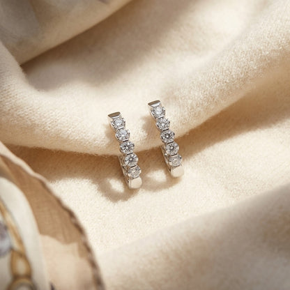 Diamond Hinged Oval Hoop Earrings in 14k White Gold 3/4ctw — textile flat lay