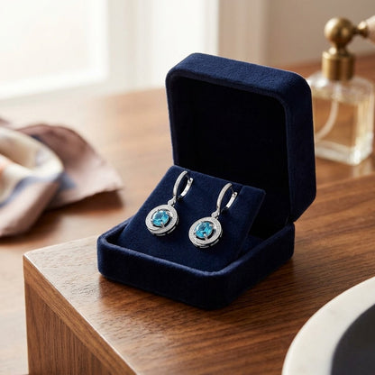 Blue Topaz and Diamond Swirl Dangling Earrings in 14k White Gold (6mm) — velvet box