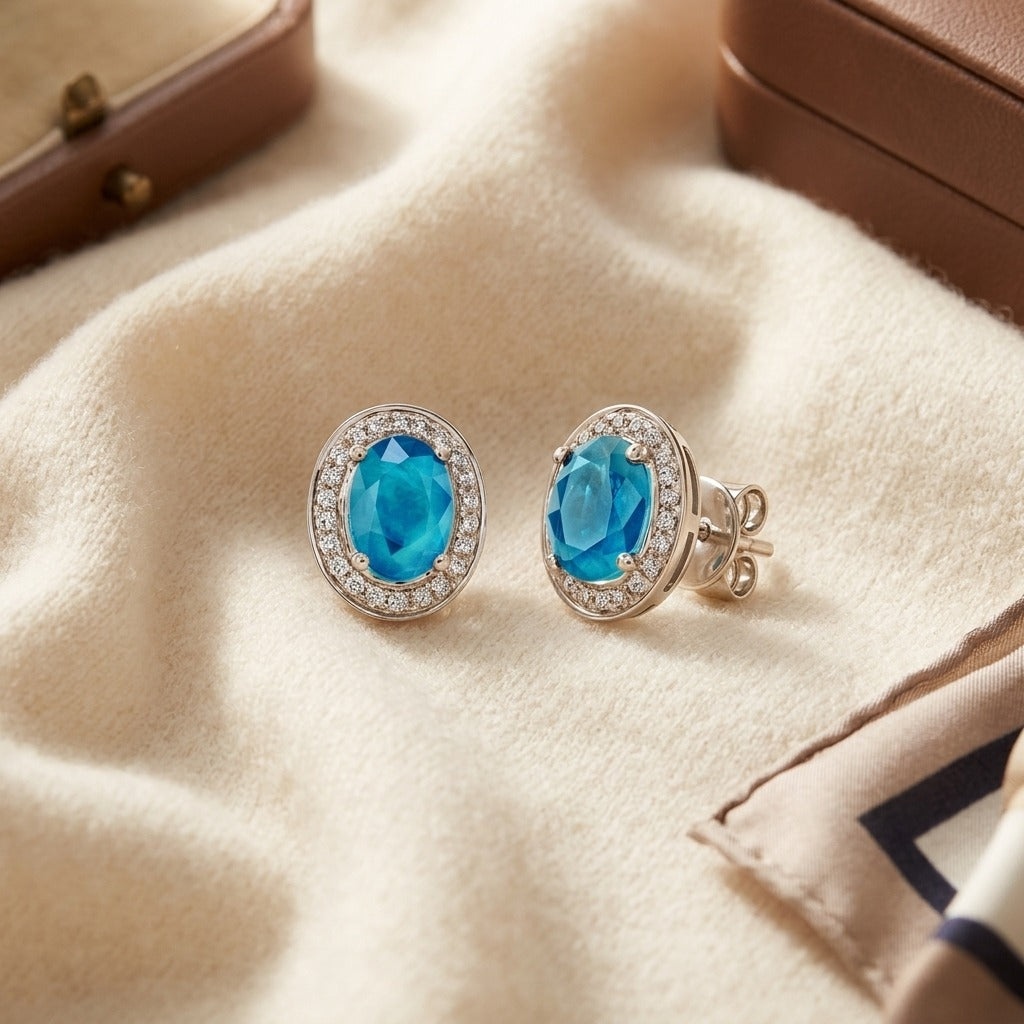 Aquamarine And Diamond Oval Halo Stud Earrings In 14k White Gold (8x6mm) — textile flat lay