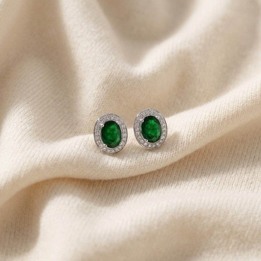 Emerald Oval And Diamond Earrings In 14k White Gold (8x6mm) — textile flat lay