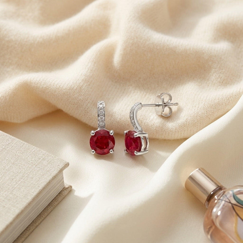 Ruby And Diamond Earrings In 14k White Gold — textile flat lay