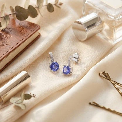 Tanzanite and Diamond Earrings in 14k White Gold — textile flat lay