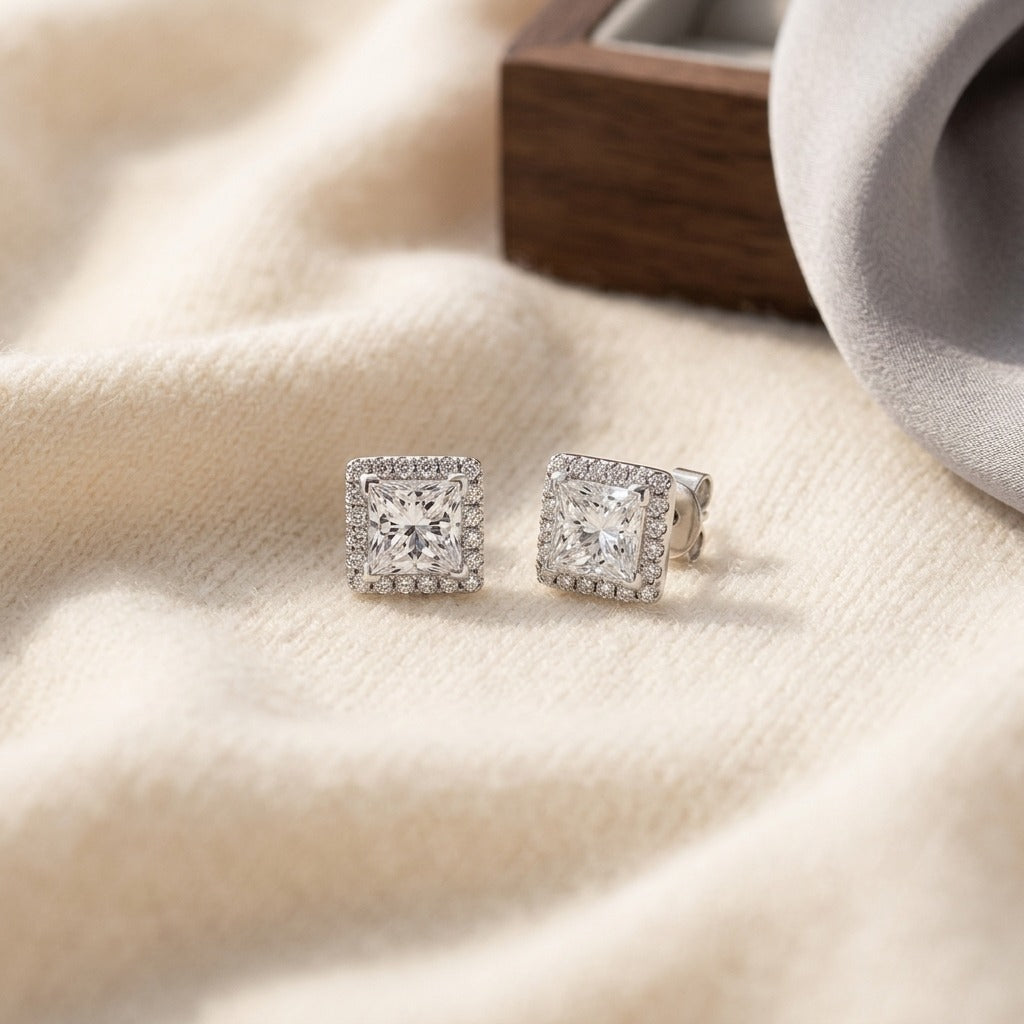 Diamond Princess Cut Halo Stud Earrings In 14k White Gold (1.45ctw) — textile flat lay