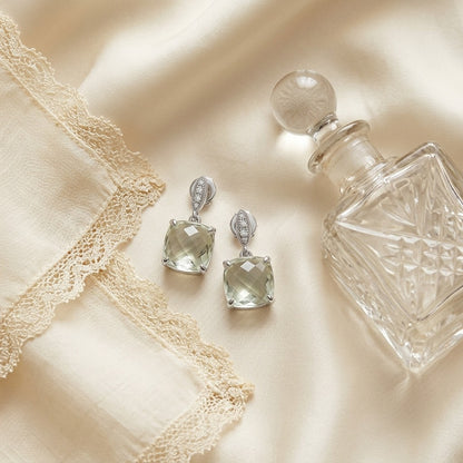 Amethyst and Diamond Earrings in 14k White Gold — textile flat lay