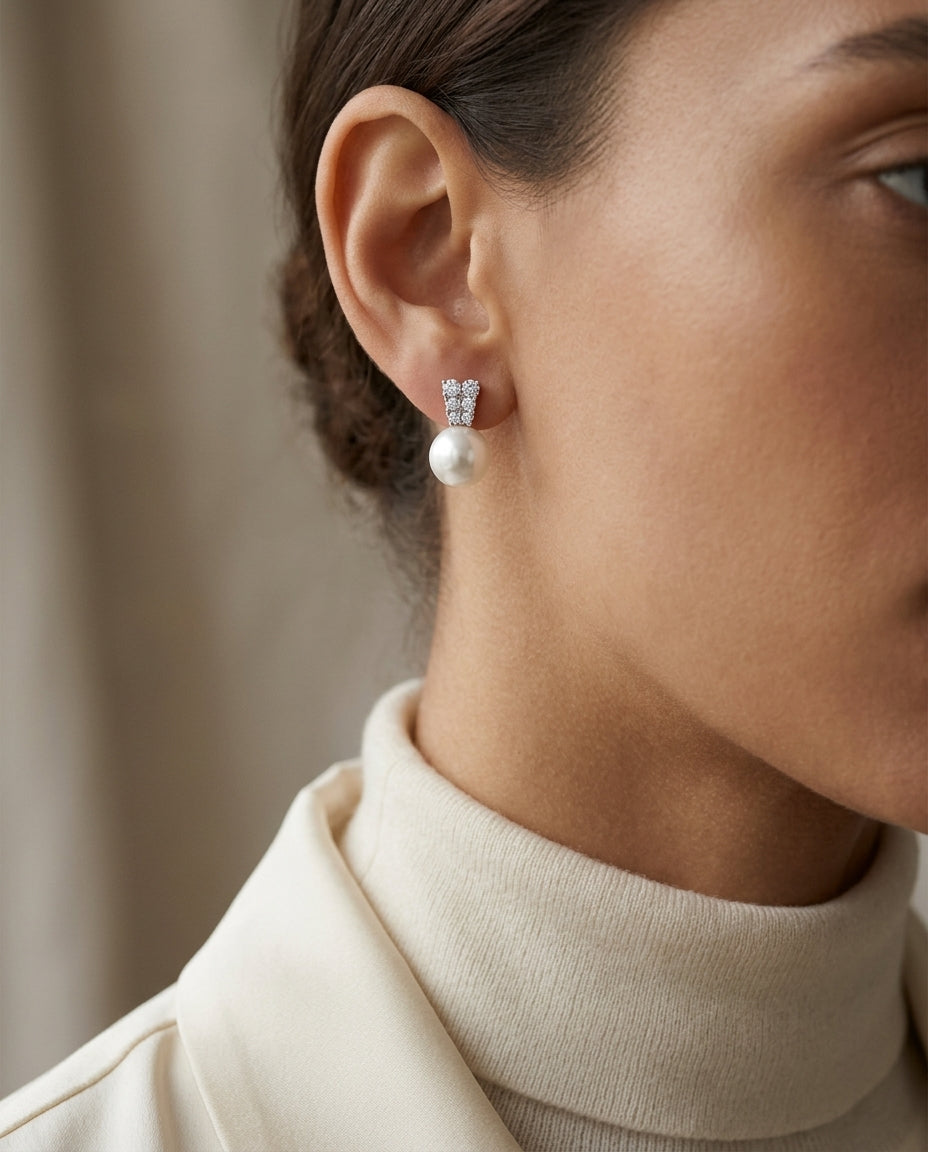 White Cultured Akoya Pearl Earrings With Diamond Prong-set Tapered Tops In 14k White Gold — editorial close-up