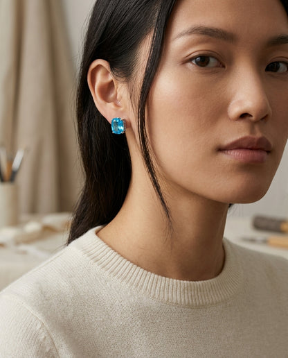 Blue Topaz Cushion 4 Prong Stud Earrings In 14k White Gold — editorial close-up