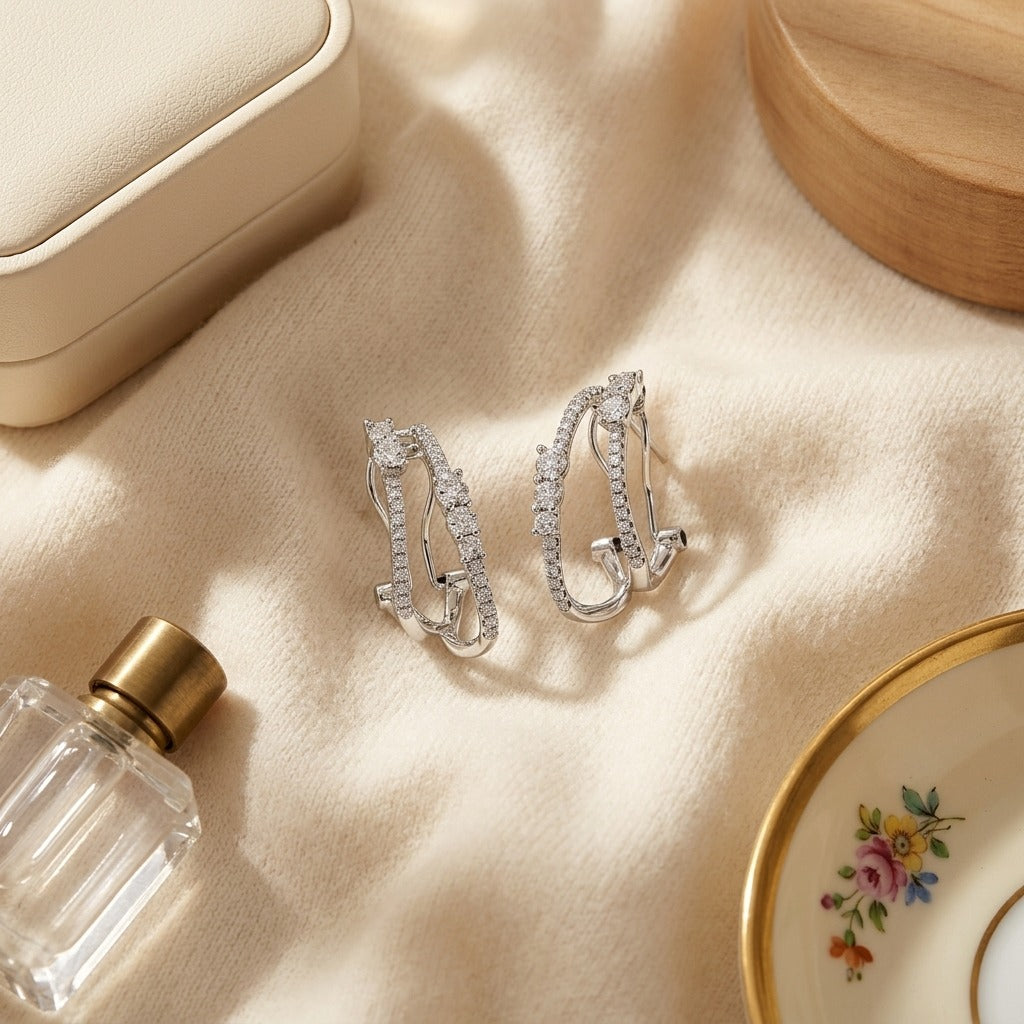 Diamond Double Row Omega Earrings In 14k White Gold — textile flat lay