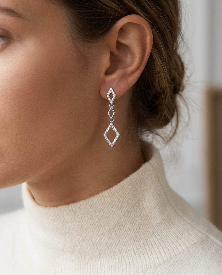 Diamond Kite Shaped Dangle Earrings In 14k White Gold — editorial close-up