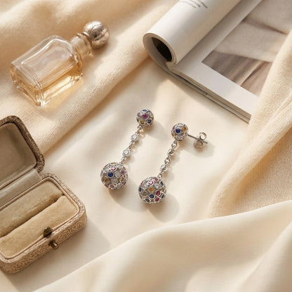14k Gold Sapphire and 1/2ct Diamond Earrings — textile flat lay