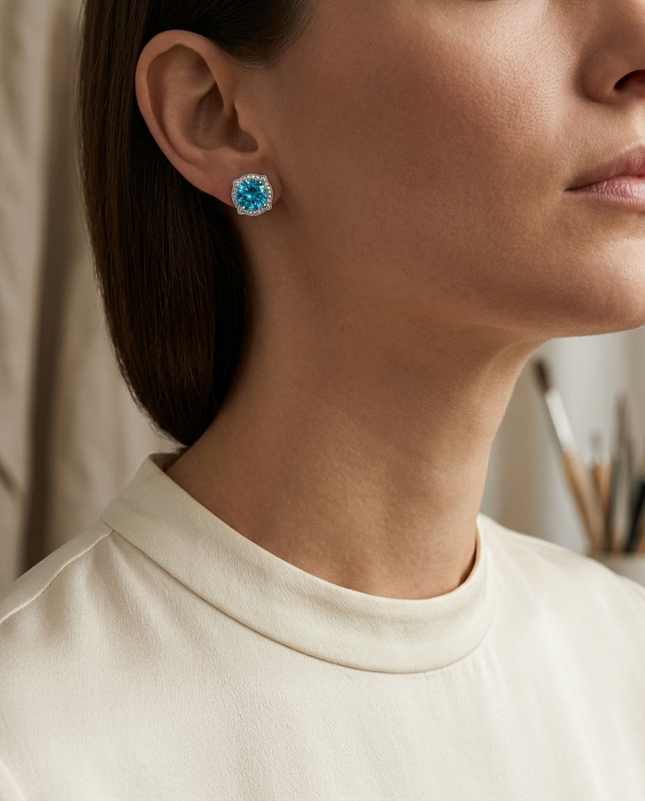 Blue Topaz And Diamond Round Halo Pinched Corner Earrings In 14k White Gold — editorial close-up