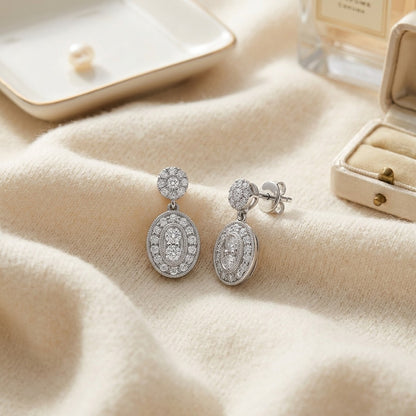 Diamond Oval Halo Dangle Earrings in 14k White Gold (3/8ctw) — textile flat lay