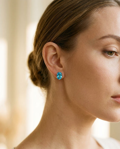 Blue Topaz Oval Stud Earrings in 14k White Gold (8x6mm) — portrait close