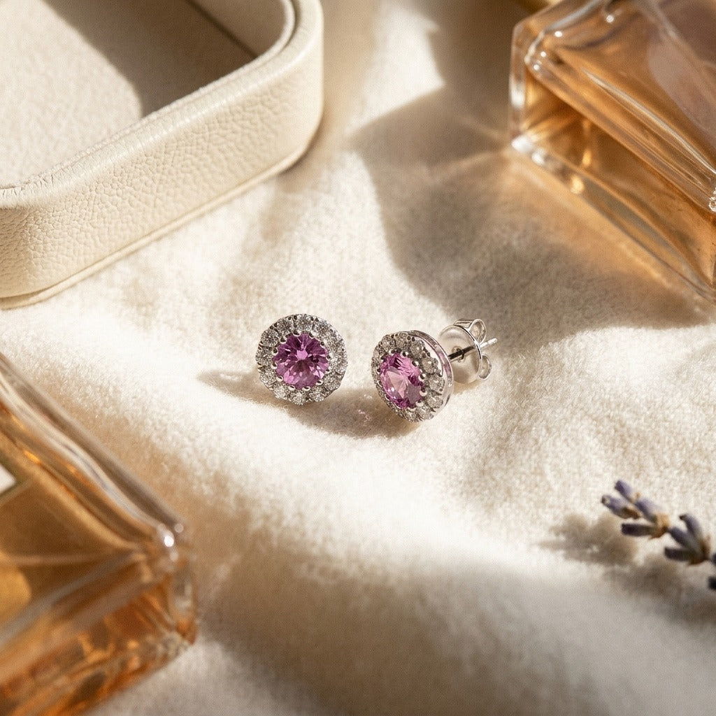 Pink Sapphire and Diamond Halo Earrings in 14k White Gold — textile flat lay
