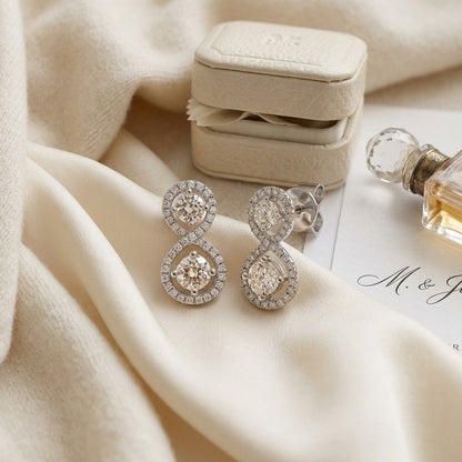 Double Diamond Infinity Pave Drop 2 Stone Earrings in 14k White Gold — textile flat lay