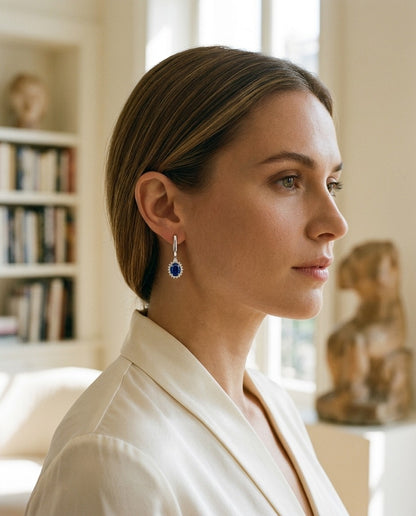 Sapphire Oval and Diamond Starburst Frame Earrings in 14k White Gold (7x5mm) — portrait close