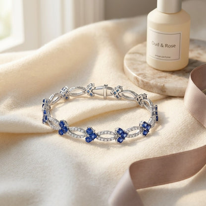 Sapphire And Diamond Composite Heart Link Bracelet In 14k White Gold — textile flat lay