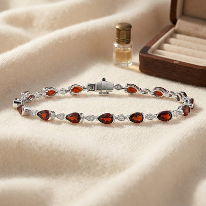 Garnet Pear-Shape and Diamond Pave East-West Bracelet in 14k White Gold (6x4mm) — textile flat lay