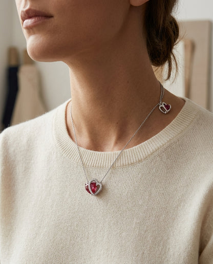 Garnet & Diamond Heart Shaped Pendant In 14k White Gold — editorial close-up