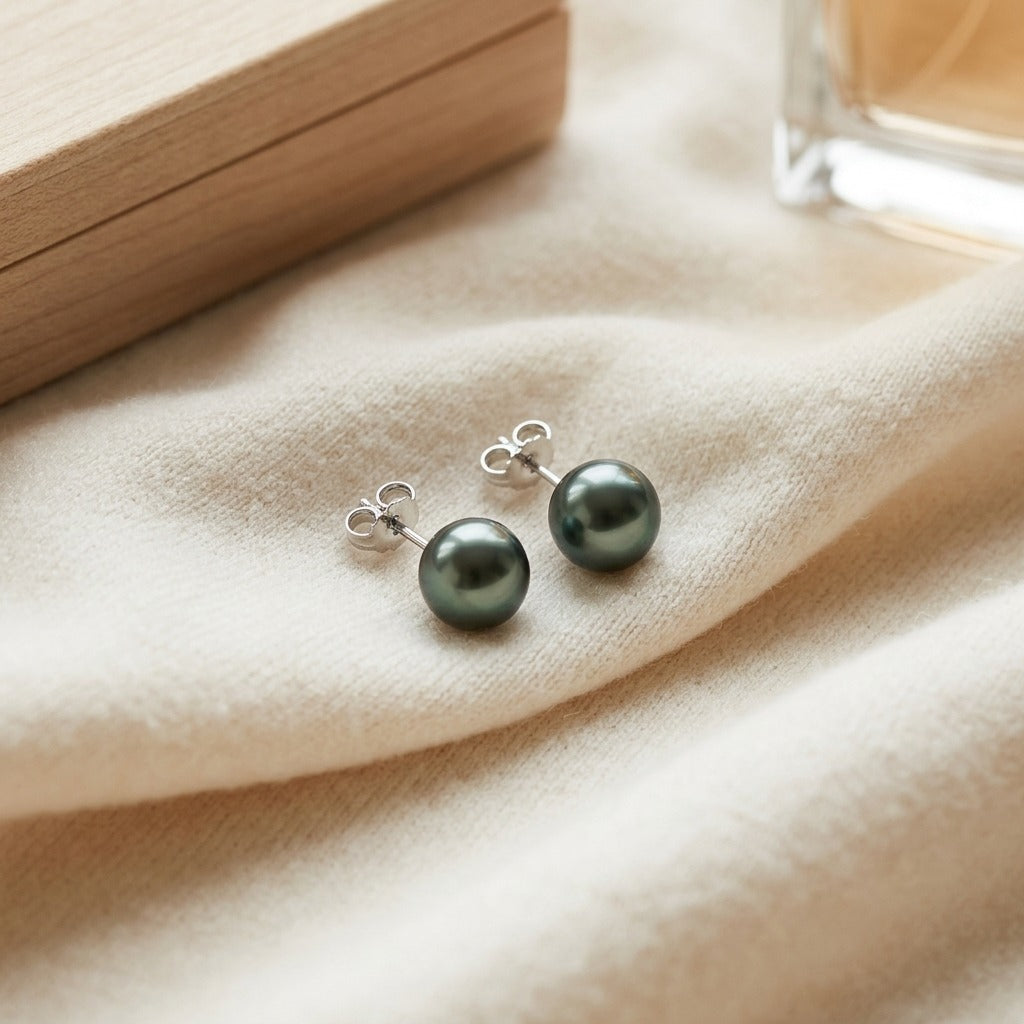 Black Sea Cultured Pearl Earrings — textile flat lay