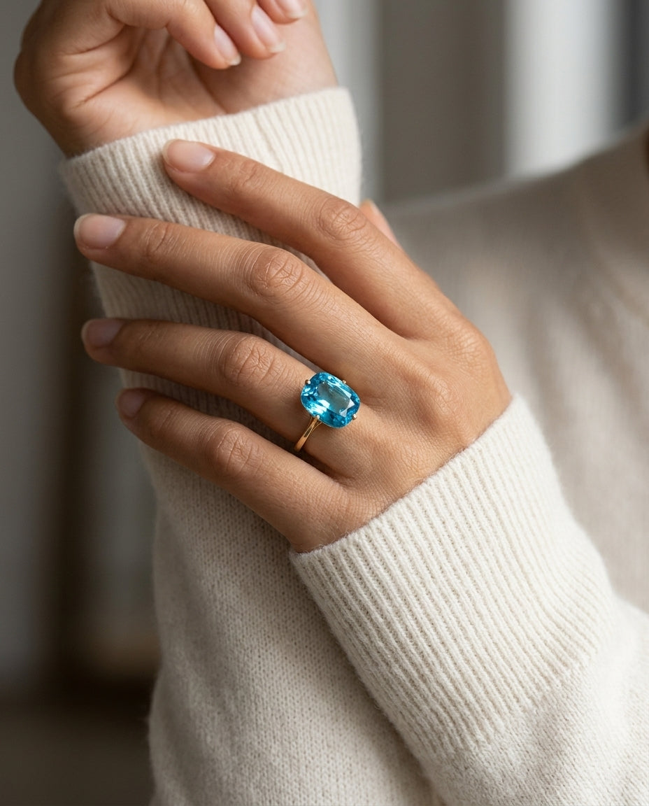 Swiss Blue Topaz Oval Ring In 14k Yellow Gold — editorial close-up